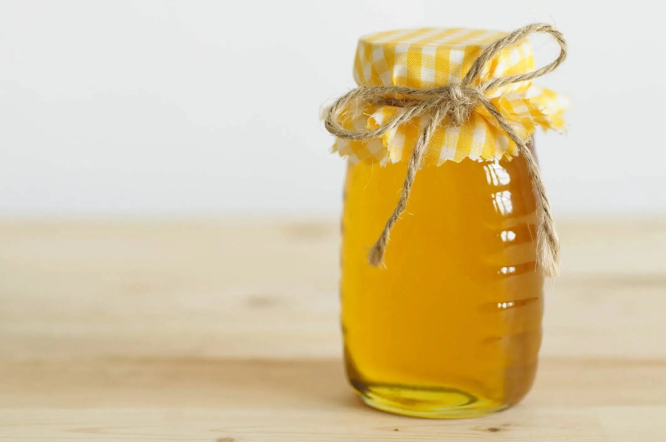 A jar of finished golden honey.
