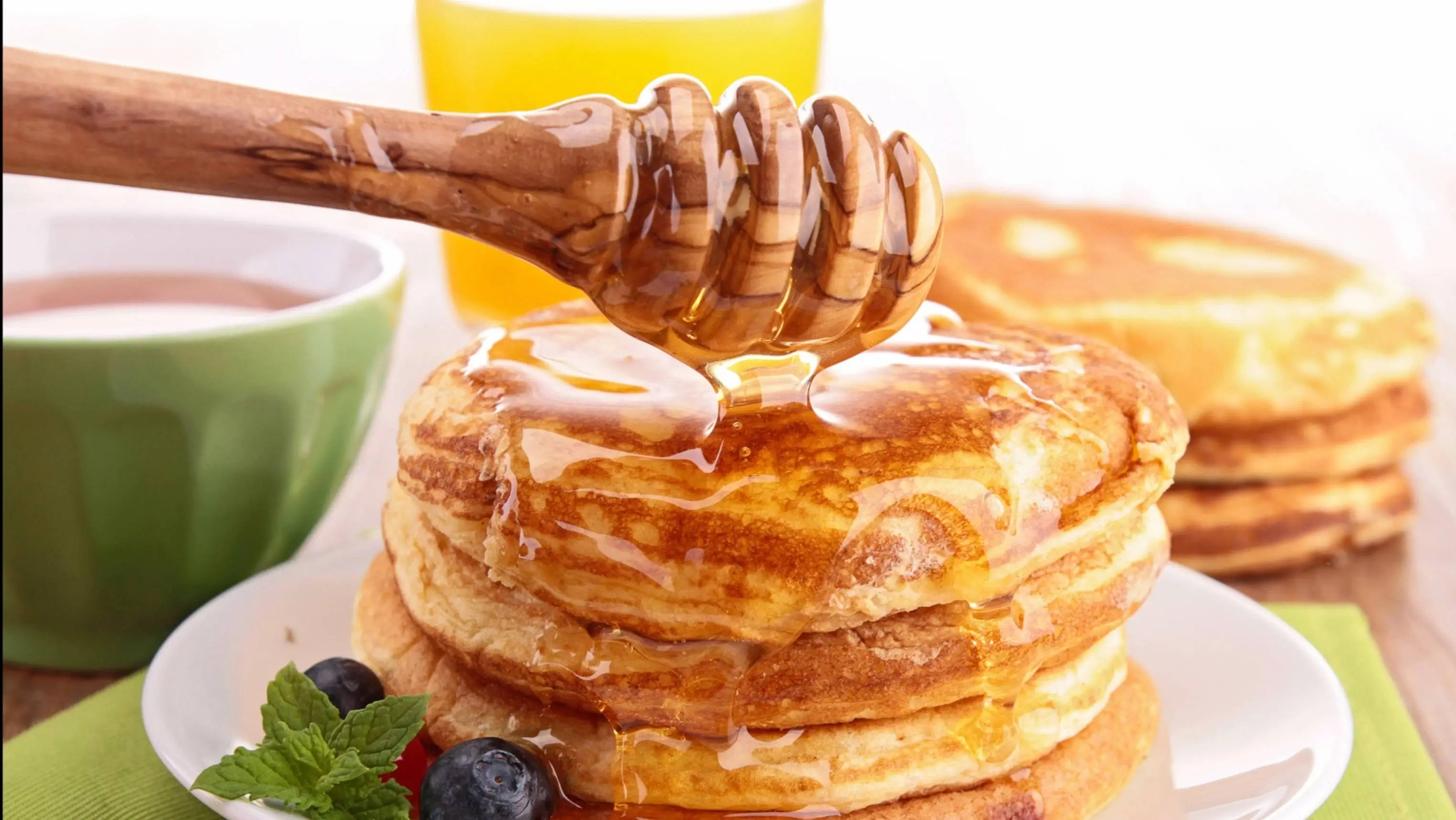 Honey drizzled over pancakes.